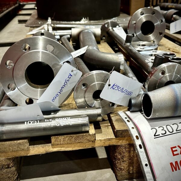 Prefabricated pipe spools with indicator marking prepared by a piping installation company for industrial construction