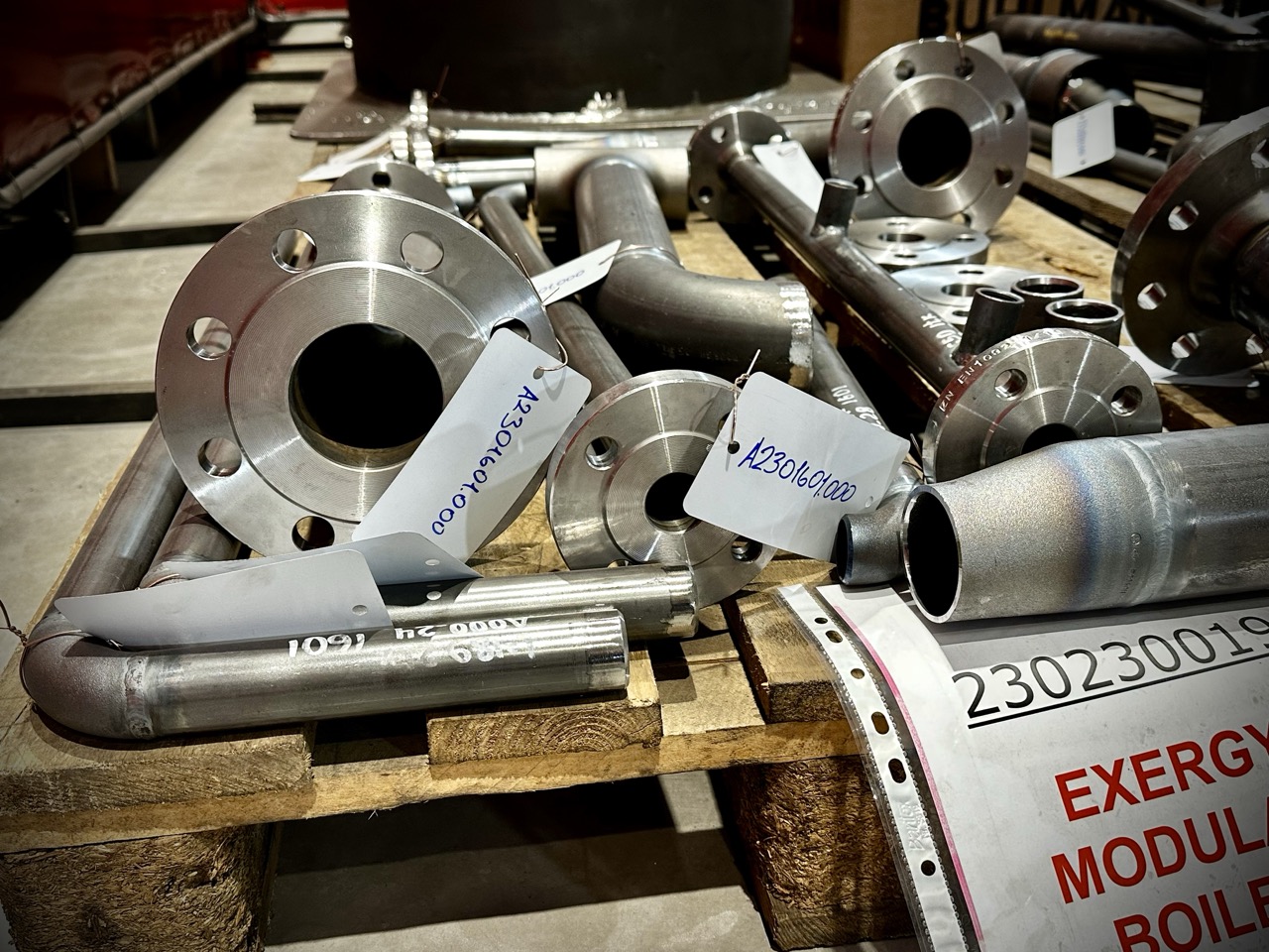 Prefabricated pipe spools with indicator marking prepared by a piping installation company for industrial construction