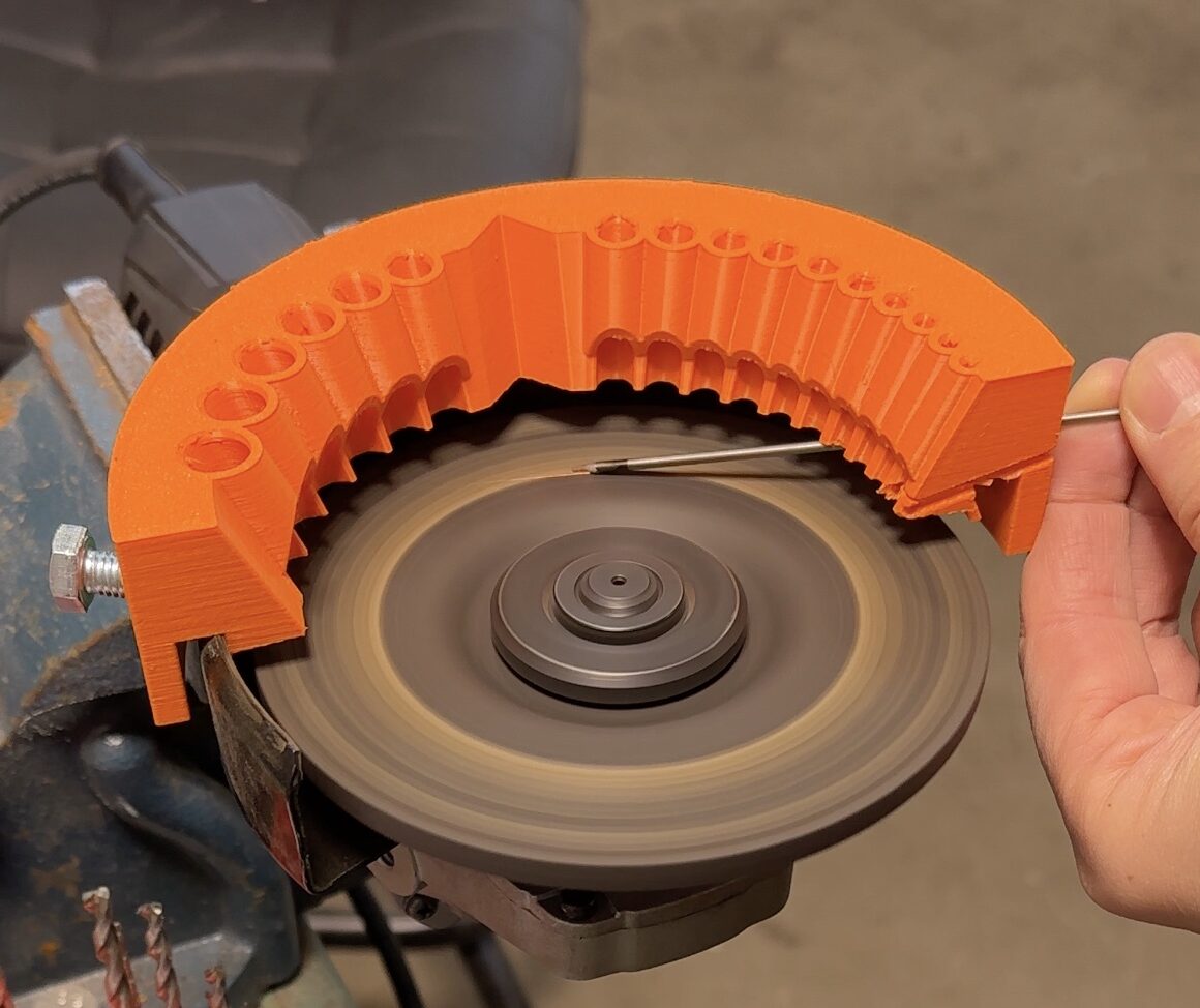 High-resolution image of the drill bit sharpener attachment mounted on an angle grinder, demonstrating its robust design and precision engineering for sharpening drill bits and tungsten electrodes.
