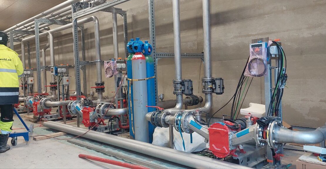 Biogas plant installation – completed pump station room with installed pumps and piping