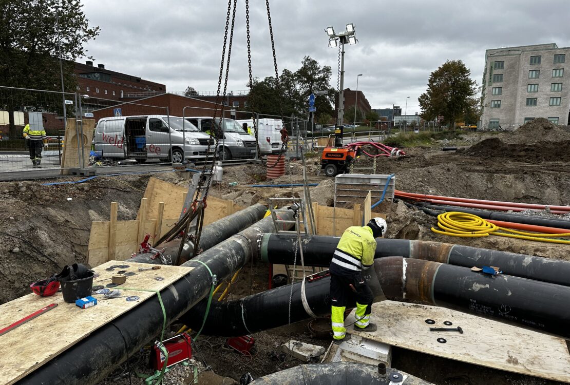 Piping installation – crane lifting pipe spool during industrial pipeline assembly